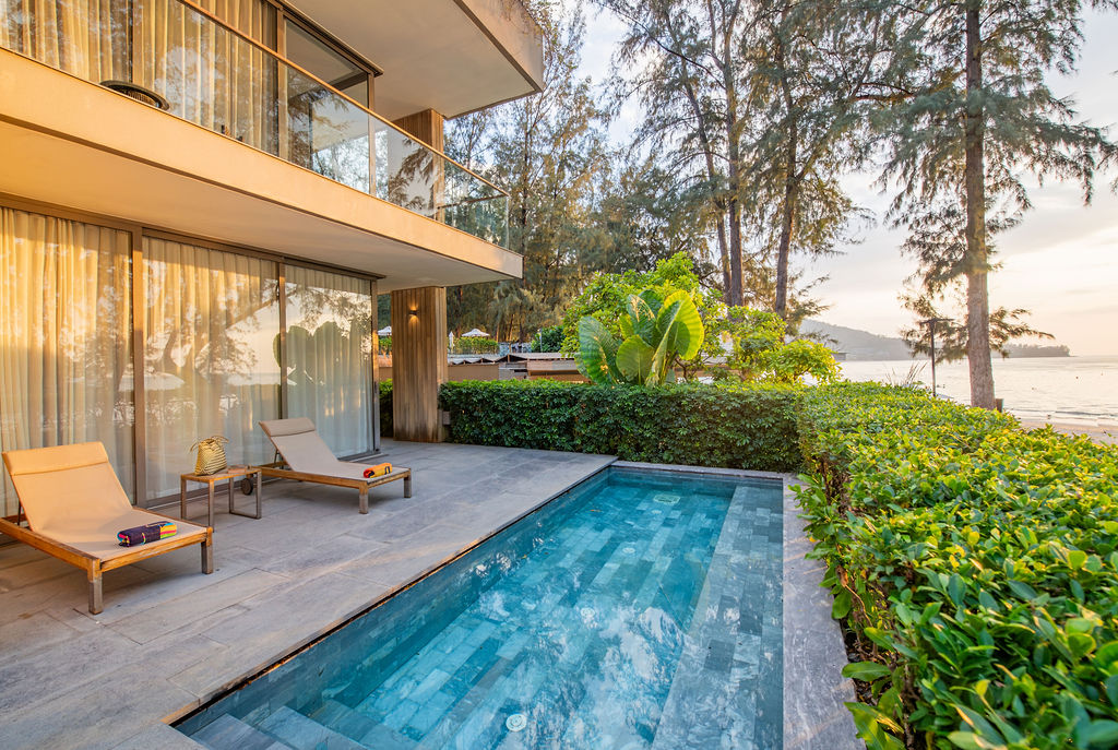 Private pool with beachfront views at sunset