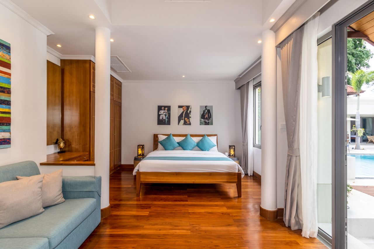 Bedroom with pool view and contemporary art