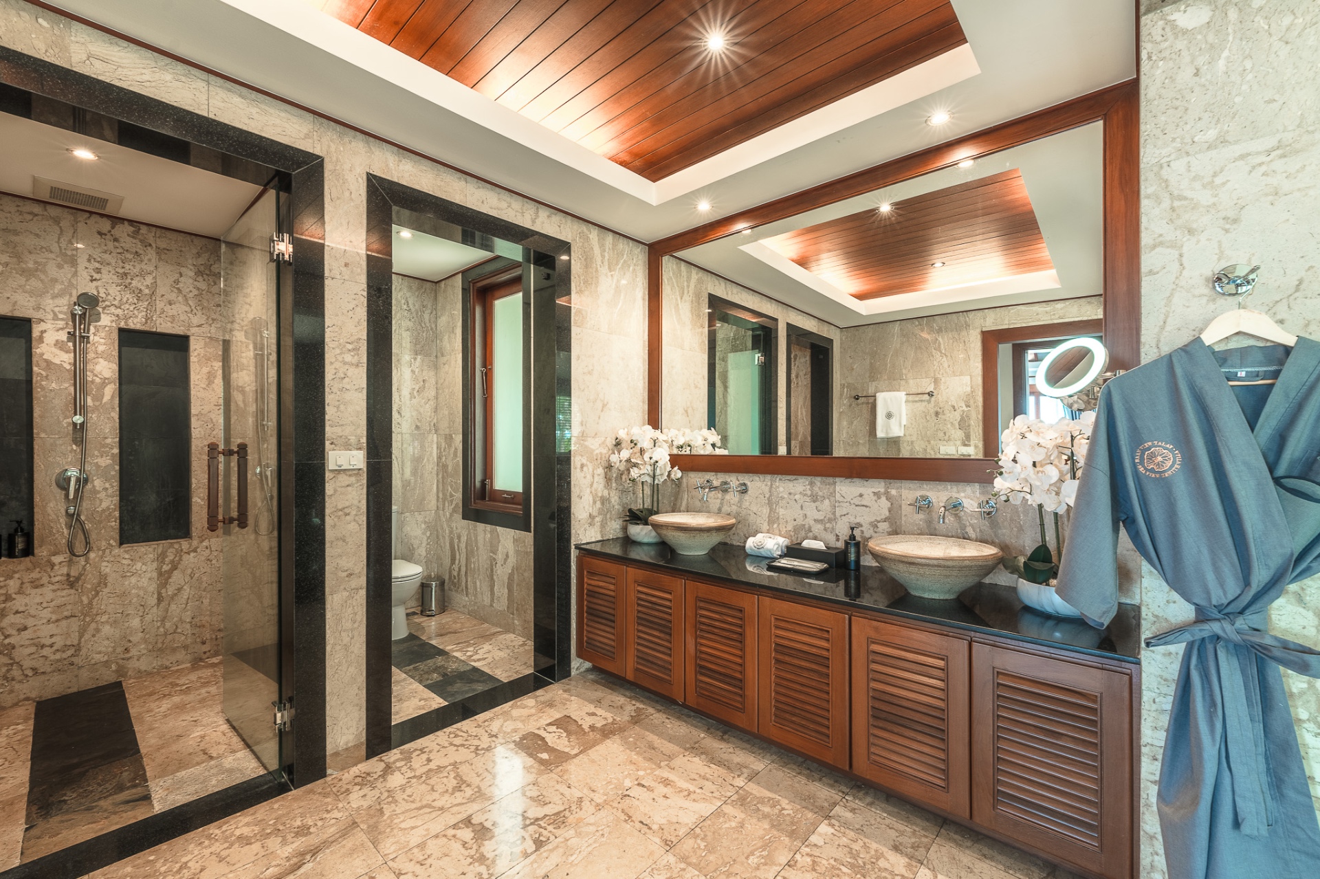 Luxury ensuite bathroom with travertine stone