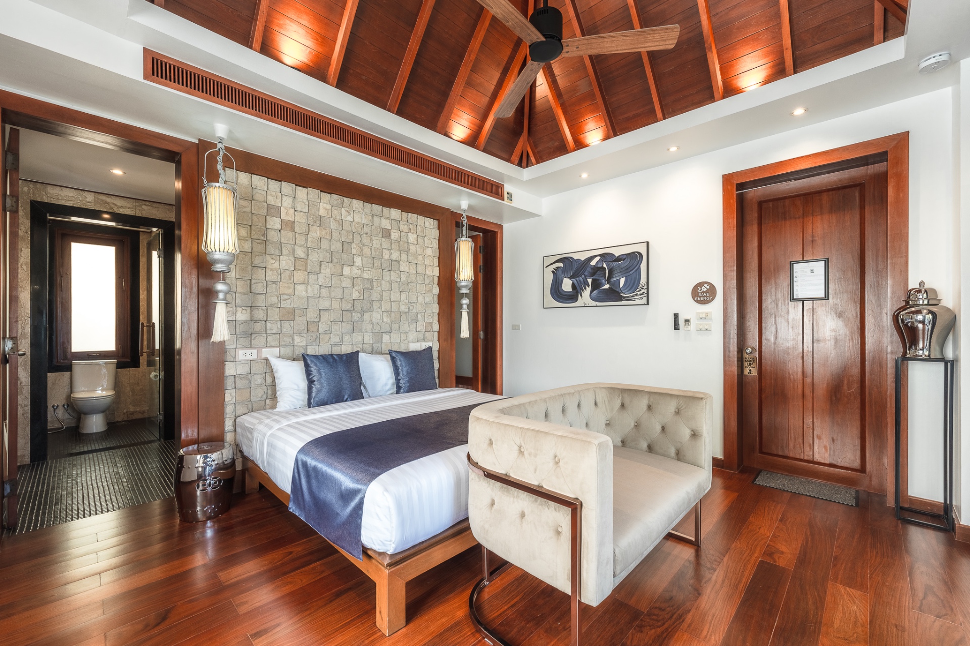 Suite with stone accent wall and ensuite bathroom