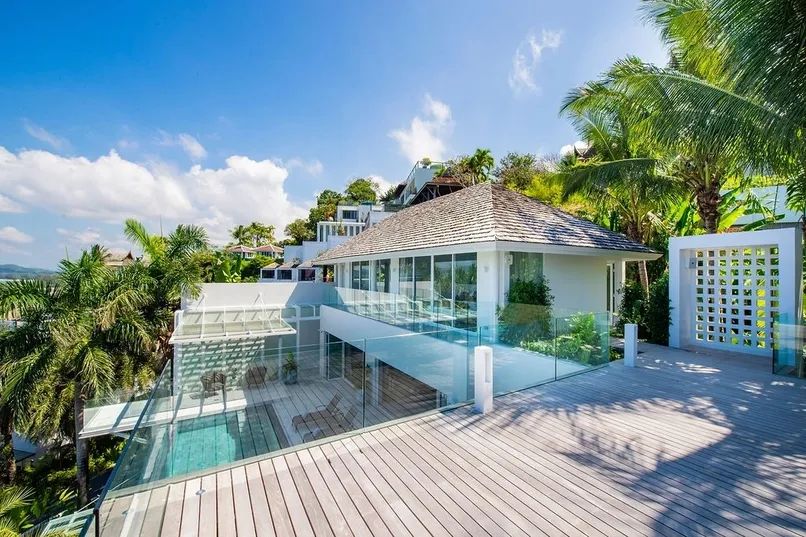 Two-level modern villa exterior with deck