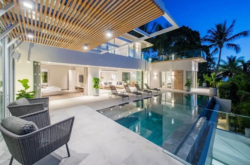 Pool deck with evening lighting and pergola