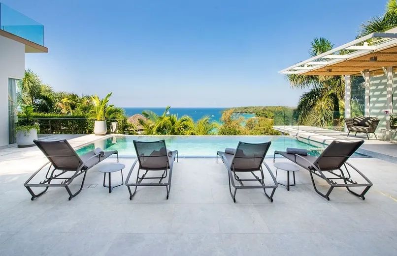 Pool loungers with stunning ocean views