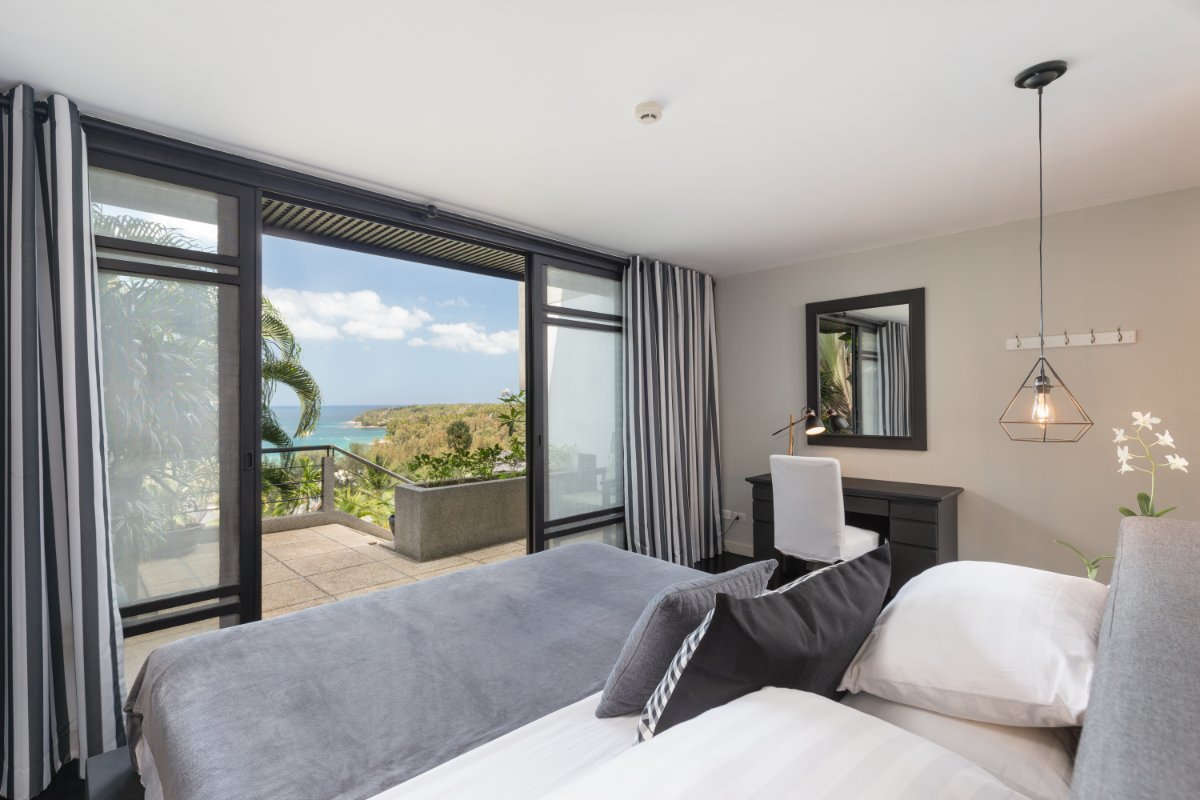 Guest bedroom with private balcony and sea view