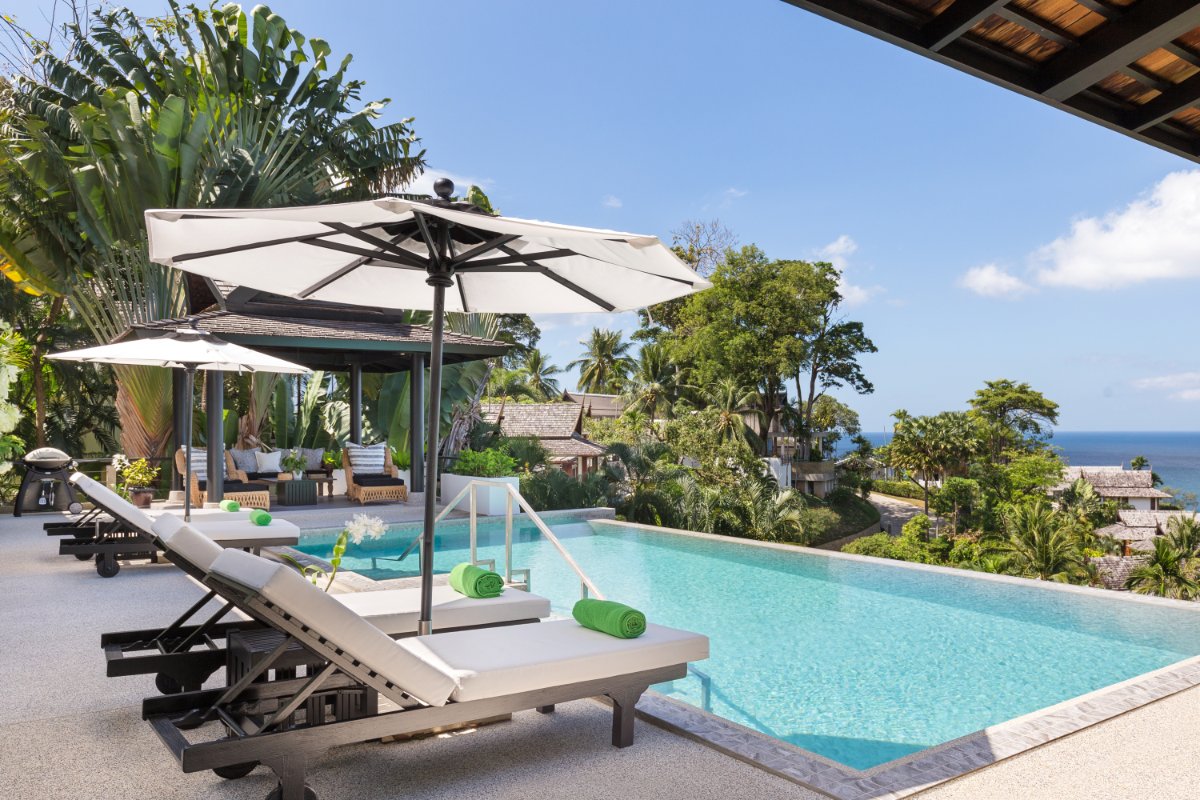 Luxury poolside loungers with sea view at Phuket villa