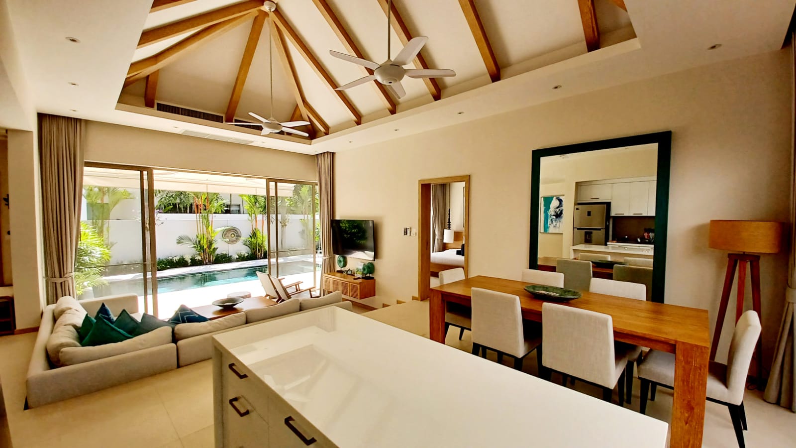 Living and dining area with pool view